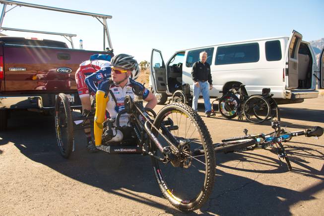 29 year-old Staff Sergeant Tim Brown, a USMC Explosive Ordnance Disposal Specialist, prepares his 3-wheel hand-powered mountain bike, built by Bill Lasher of Las Vegas, for the Ride 2 Recovery Las Vegas Mountain Bike Challenge at Blue Diamond Monday, Jan. 27, 2014. Brown, who lost 3 limbs during a roadside bomb attack in Afghanistan in Oct. of 2011, is among many wounded veterans who are being helped by Ride 2 Recovery, a nonprofit organization that provides rehabilitation to injured veterans through cycling.